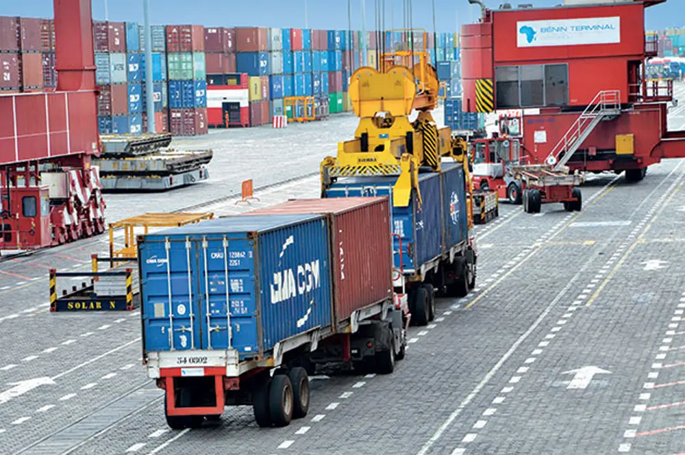 Picture of trucks moving containers at a port in Nigeria